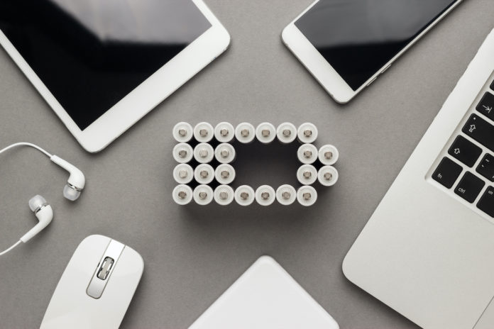 conceptual image of battery charge level pictogram and mobile devices